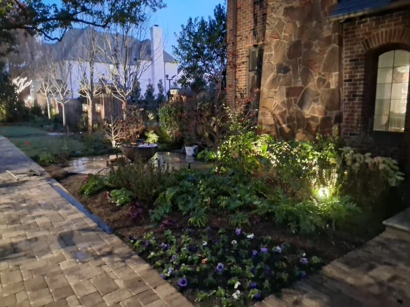 Client-supplied garden photograph at dusk.